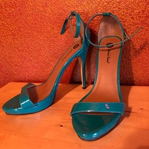 Blue-Green heeled sandals.